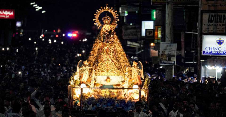 Filipinos gathered in prayer at the Manaoag shrine representing the deep Catholic faith and Marian devotion of the Filipino community honored by Our Lady of Manaoag Hawaii Devotees